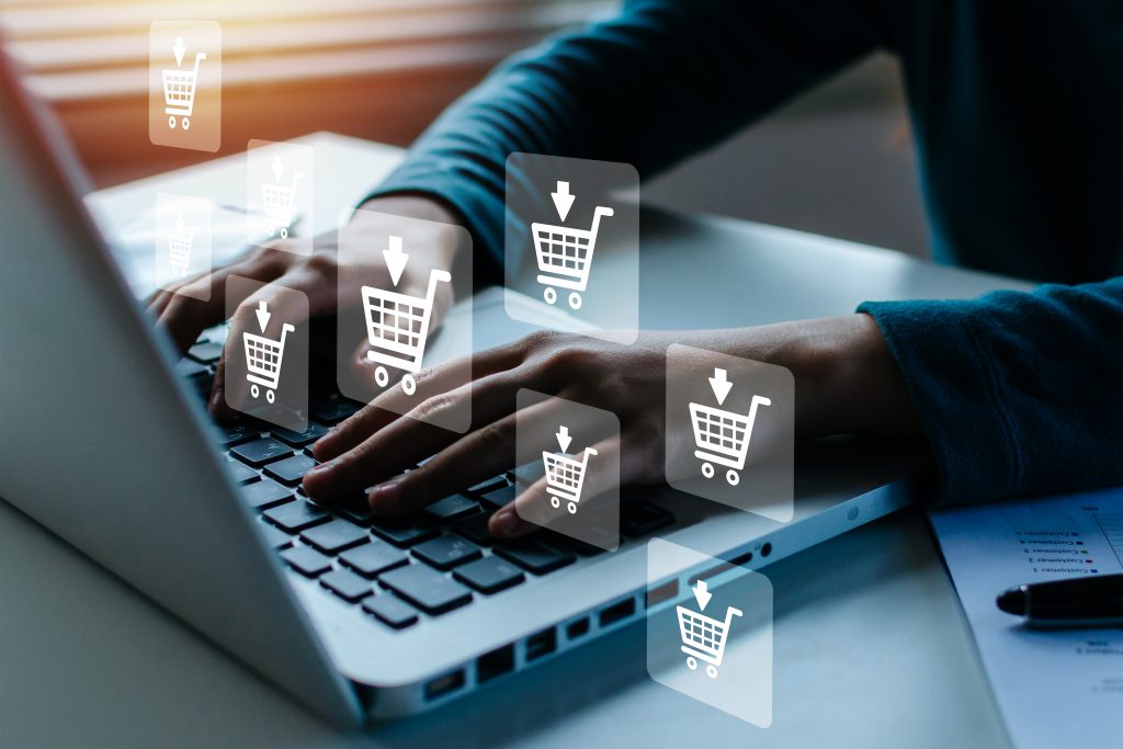 E-Commerce Buchführung Matthias von Löwe Online Shopping. woman hand online shopping on laptop computer with virtual graphic icon diagram on desk, payment online, digital marketing, business finance, internet network technology concept